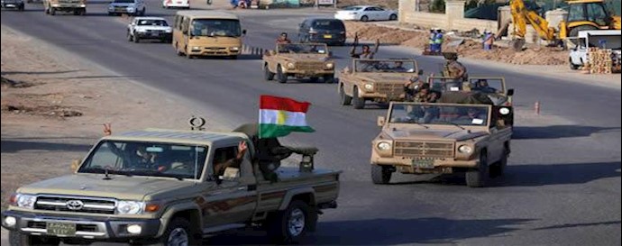 مقاتلون من البيشمرغة يغادرون شمال العراق في طريقهم إلی "کوباني" عبر ترکيا