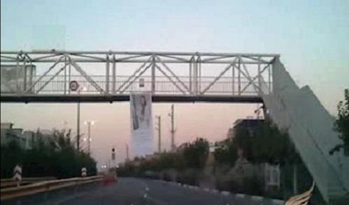 نشاطات أنصار المقاومة بتعليق لافتة کبيرة في طهران بمناسبة ذکری يوم إعلان انتخاب مريم رجوي رئيسة الجمهورية من قبل المقاومة الإيرانية