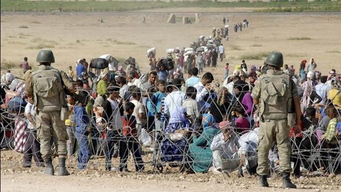 ألفا لاجئ يعبرون إلی ترکيا بسبب المعارک في سوريا