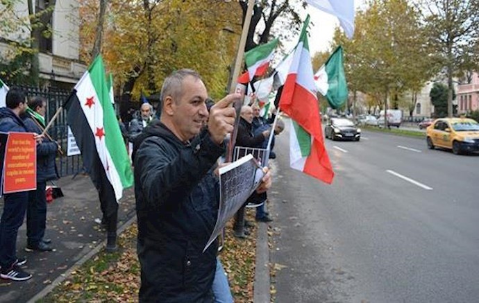 ايران ... احتجاج علی حضور ظريف في رومانيا من قبل عضو برلماني و الجاليات الايرانية و السورية