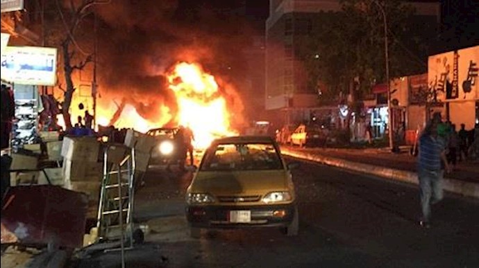 انفجار سيارتين مفخختين أمام مرکز تسوق وسط بغداد