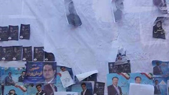 إيران.. رأس الخيط تمزيق لوحات روحاني ورئيسي الدعائية بيد مجاهدي خلق